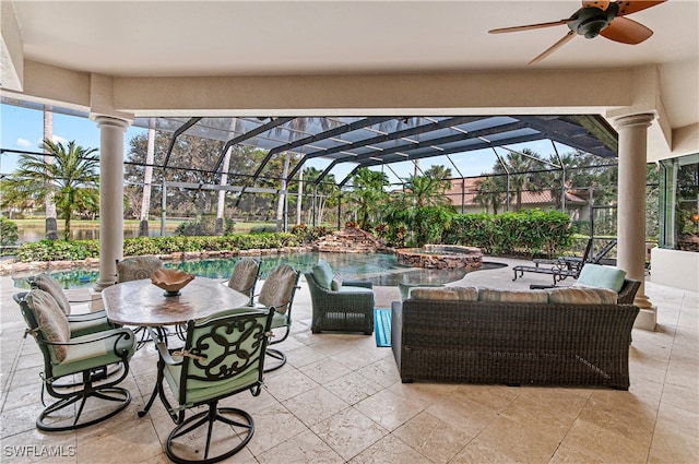 view of patio / terrace with glass enclosure, ceiling fan, and a pool with hot tub