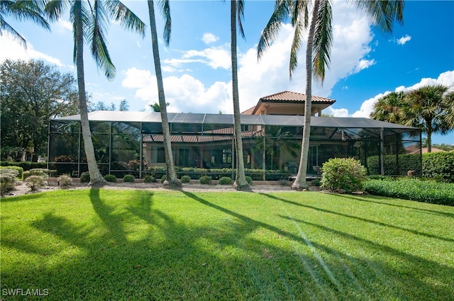 view of yard featuring glass enclosure