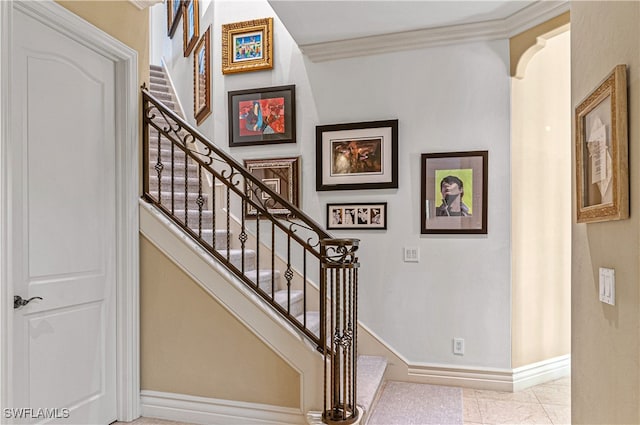 stairs featuring tile patterned floors and crown molding