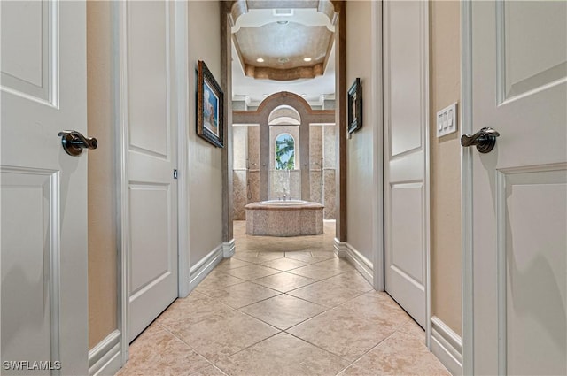 hall featuring light tile patterned flooring