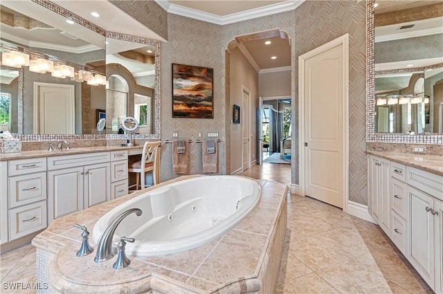 bathroom featuring crown molding, tile patterned floors, vanity, and tiled tub