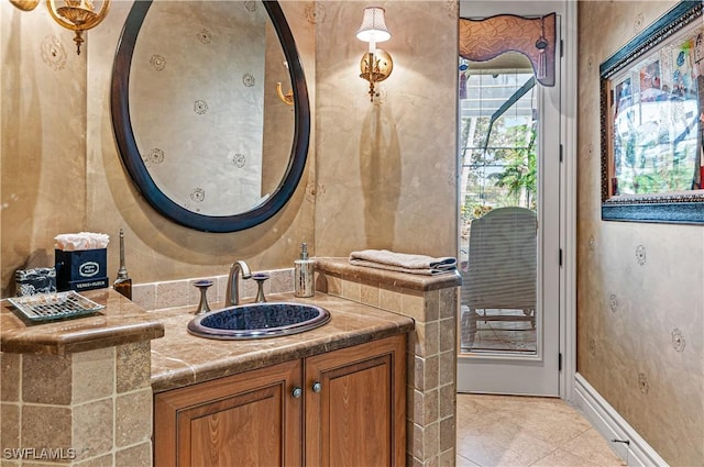 bathroom with tile patterned floors and vanity