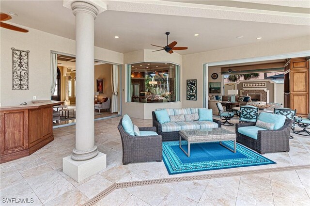 view of patio featuring ceiling fan and an outdoor living space