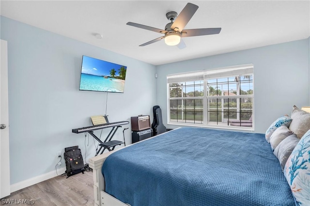 bedroom featuring ceiling fan and light wood-type flooring