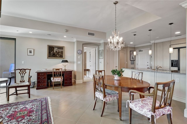 dining room featuring light tile patterned flooring, ornamental molding, and a notable chandelier