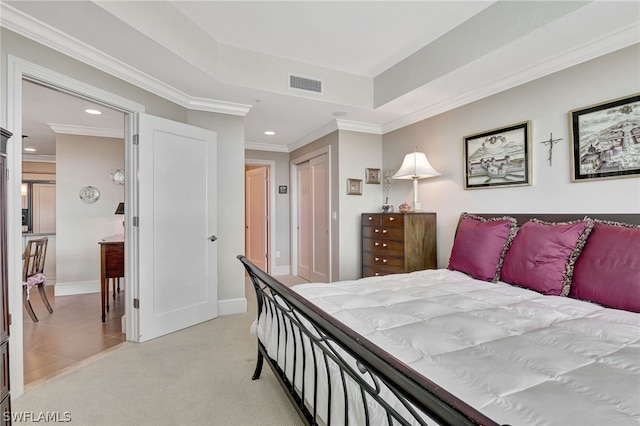 bedroom with light colored carpet, a closet, and crown molding