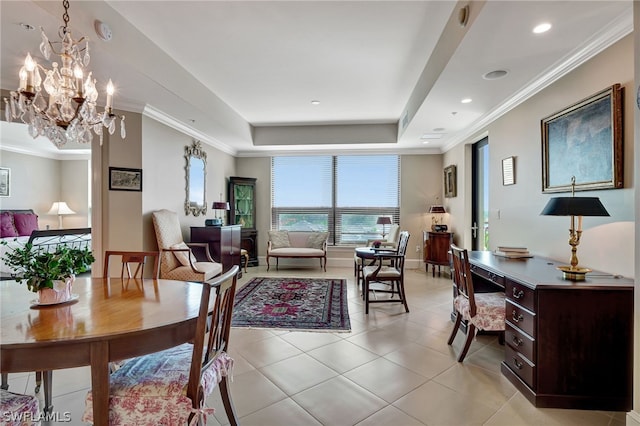 interior space with crown molding, a notable chandelier, and a tray ceiling