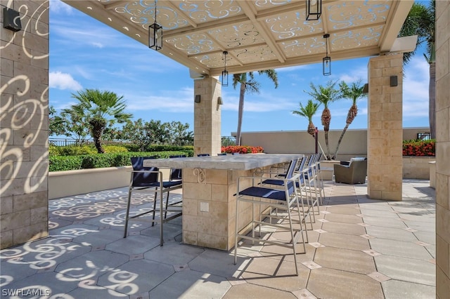 view of patio with a bar