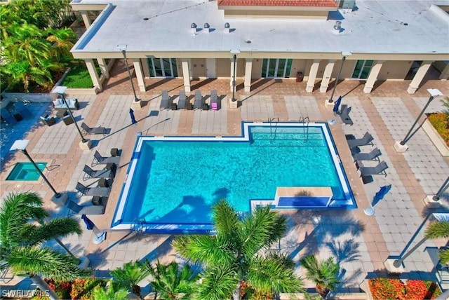 view of swimming pool with a patio