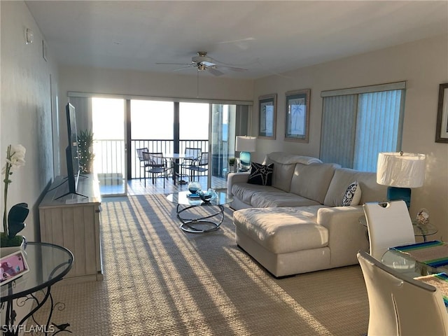 living room featuring carpet flooring and ceiling fan