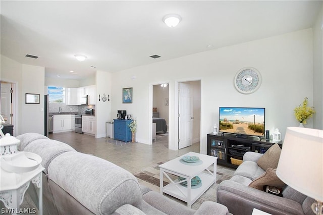 living room featuring sink