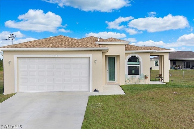 view of front facade with a front lawn and a garage