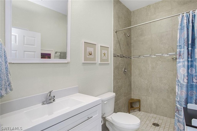 bathroom with walk in shower, vanity, and toilet