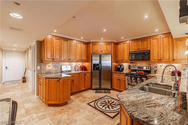 kitchen with stainless steel appliances, stone counters, sink, and light tile patterned floors