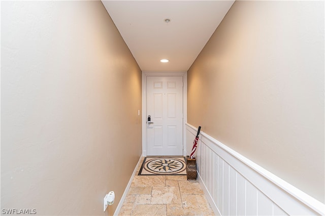 corridor with light tile patterned floors