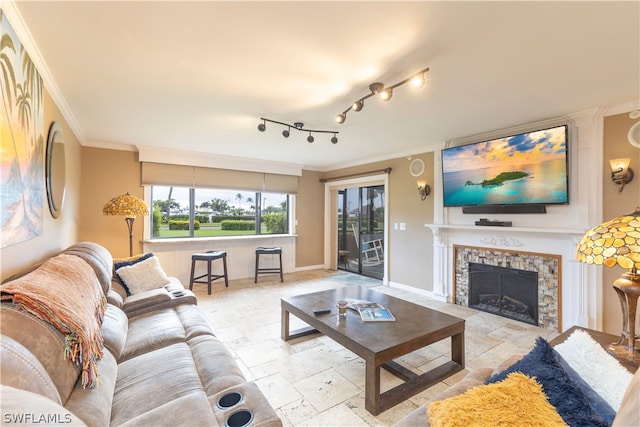 tiled living room with rail lighting and crown molding