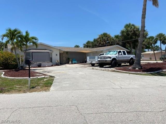 ranch-style house featuring a garage