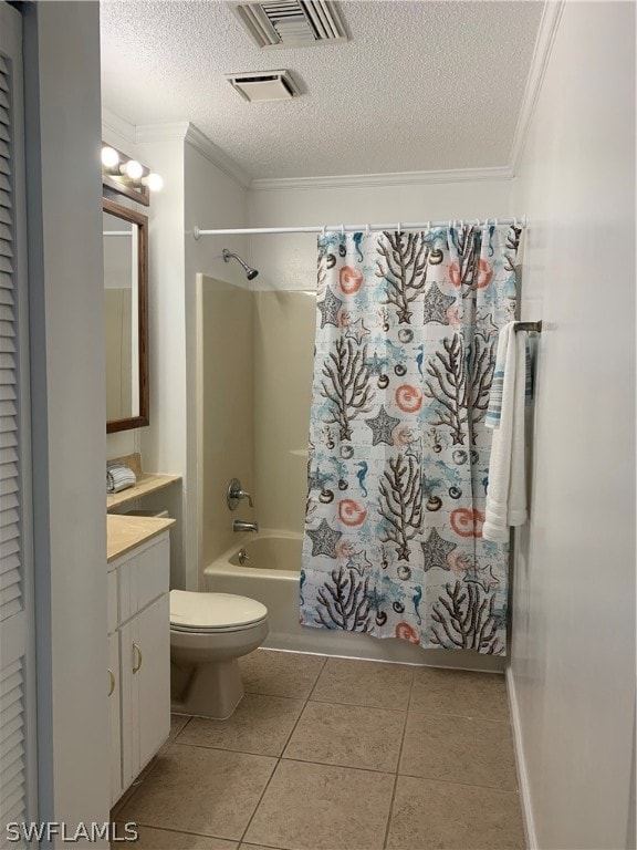 full bathroom with crown molding, tile flooring, toilet, and a textured ceiling