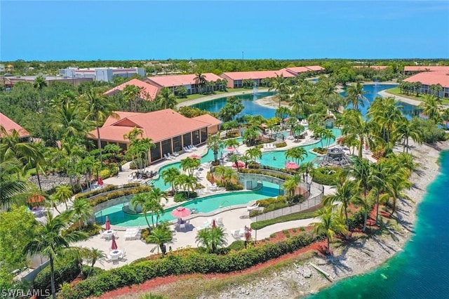 birds eye view of property with a water view