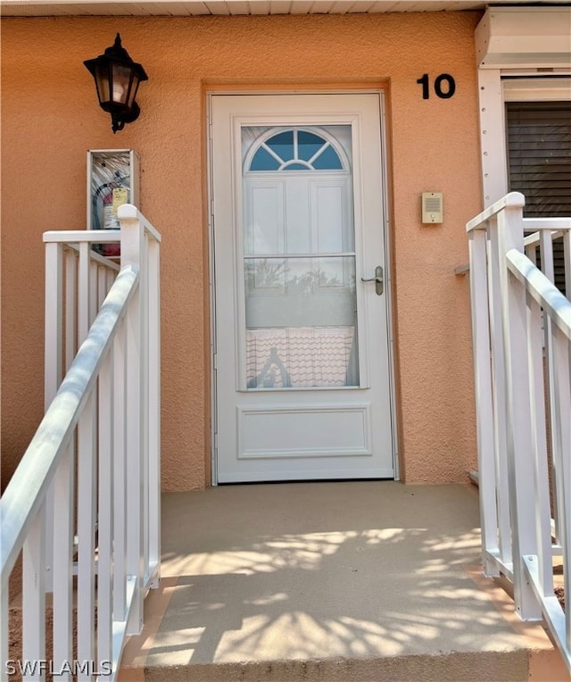 doorway to property featuring a balcony