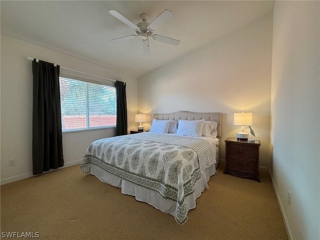 bedroom featuring ceiling fan, lofted ceiling, and light carpet