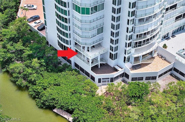 birds eye view of property featuring a water view