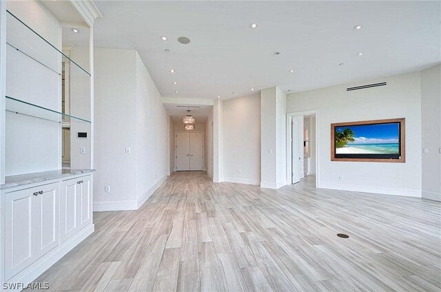 unfurnished living room featuring light hardwood / wood-style flooring