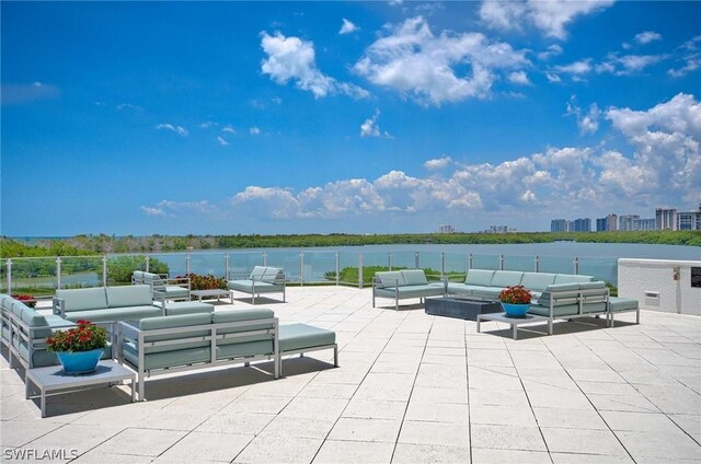 view of patio with a water view and an outdoor hangout area