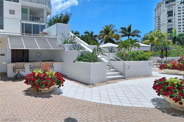 view of patio featuring exterior bar