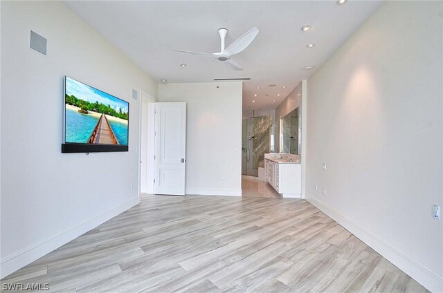 unfurnished room featuring light hardwood / wood-style flooring and ceiling fan