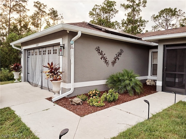 view of side of property with a garage