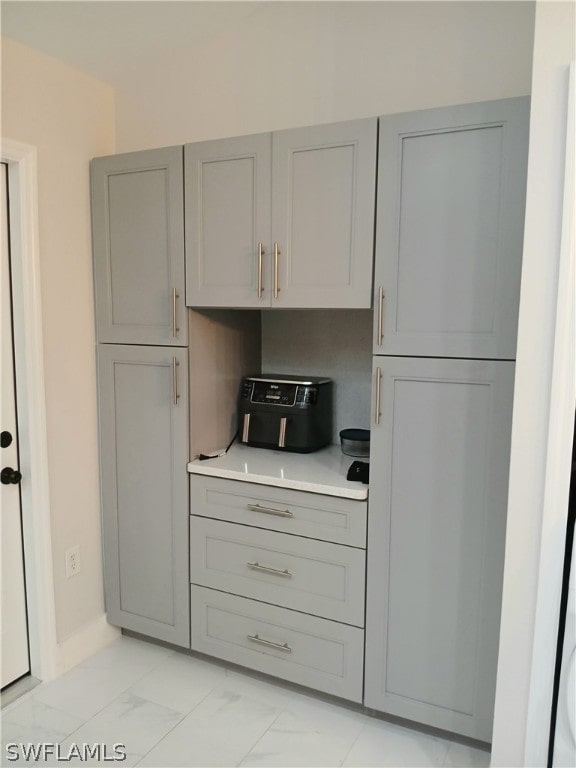 kitchen with gray cabinetry