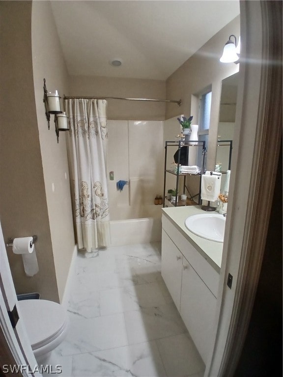 full bathroom featuring vanity, toilet, and shower / tub combo with curtain