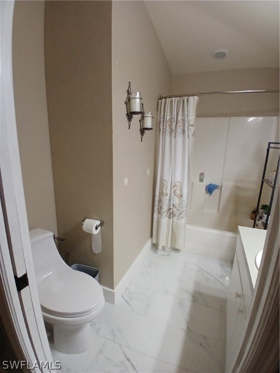 full bathroom with shower / bath combo with shower curtain, vanity, and toilet