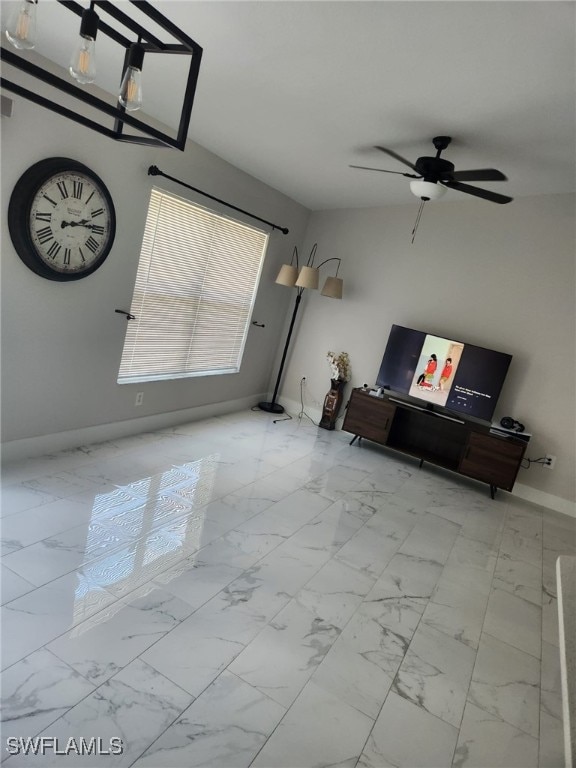 unfurnished living room featuring ceiling fan