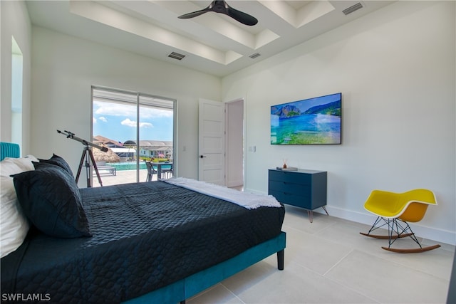 bedroom featuring ceiling fan, tile flooring, and access to outside