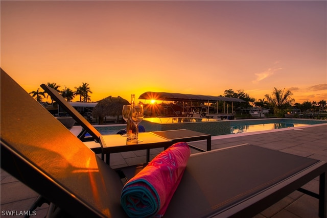 view of pool at dusk