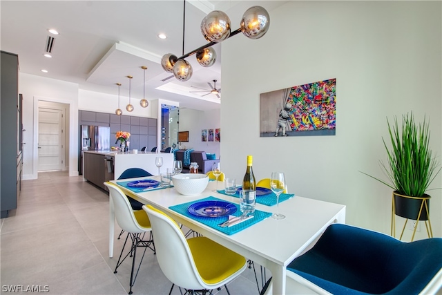 tiled dining room featuring ceiling fan