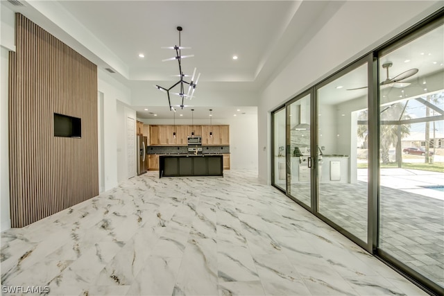 unfurnished living room with light tile patterned flooring and ceiling fan