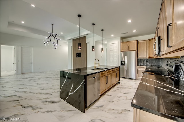 kitchen featuring appliances with stainless steel finishes, backsplash, light tile patterned floors, and an island with sink