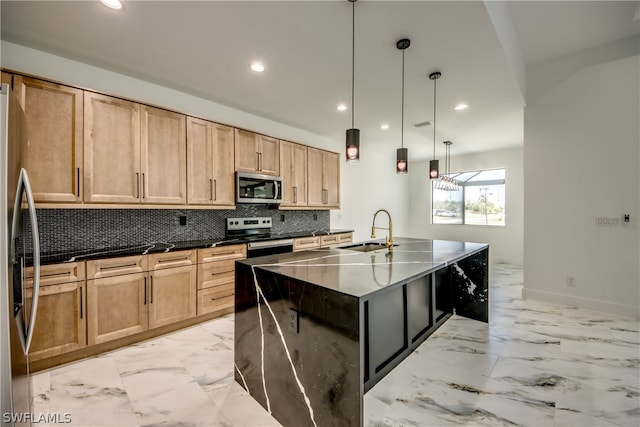 kitchen featuring light tile patterned flooring, pendant lighting, an island with sink, appliances with stainless steel finishes, and backsplash