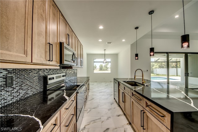 kitchen with light tile patterned flooring, stainless steel appliances, hanging light fixtures, decorative backsplash, and sink