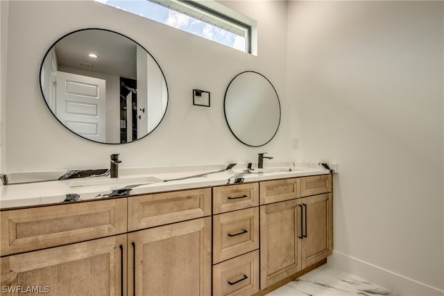 bathroom featuring tile patterned floors and double sink vanity