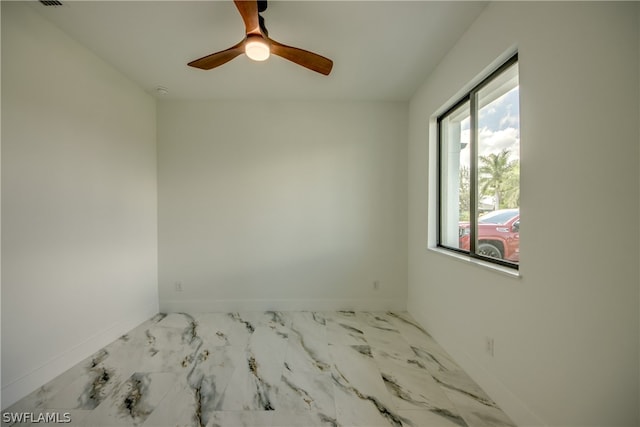 unfurnished room featuring ceiling fan