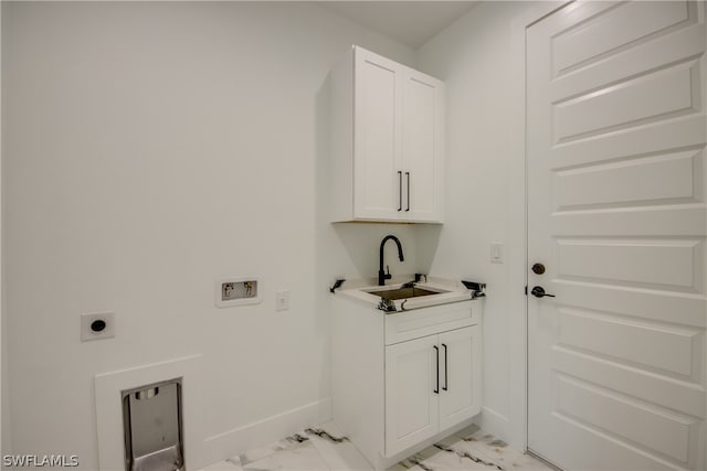 clothes washing area with hookup for an electric dryer, light tile patterned floors, hookup for a washing machine, cabinets, and sink