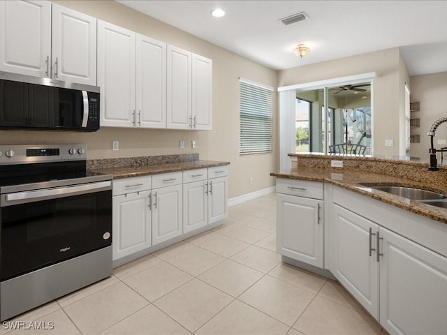 kitchen with white cabinetry, sink, and appliances with stainless steel finishes