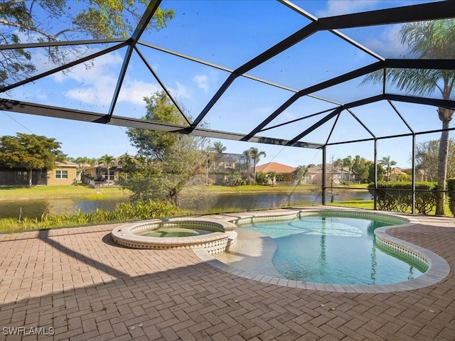 view of swimming pool featuring a patio, an in ground hot tub, a water view, and glass enclosure