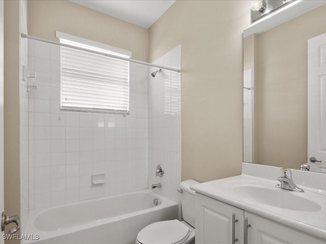 full bathroom with vanity, toilet, and tiled shower / bath combo