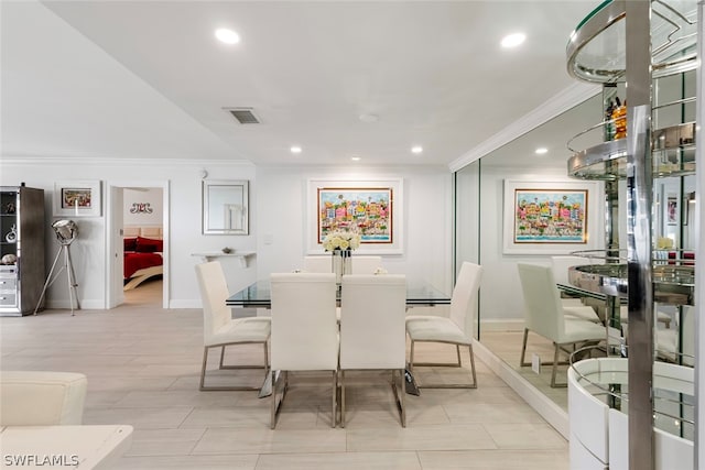 dining area with ornamental molding