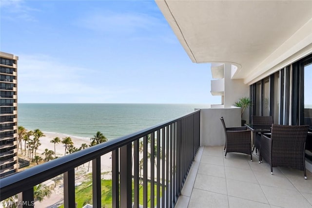 balcony with a view of the beach and a water view